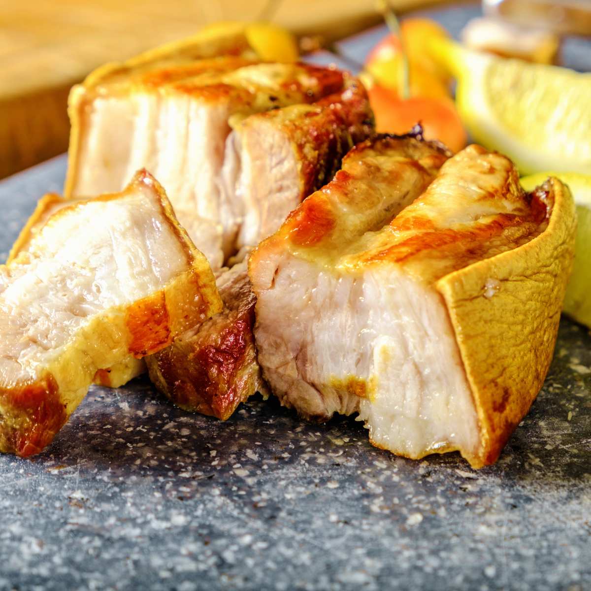 Pork belly sliced on a kitchen surface