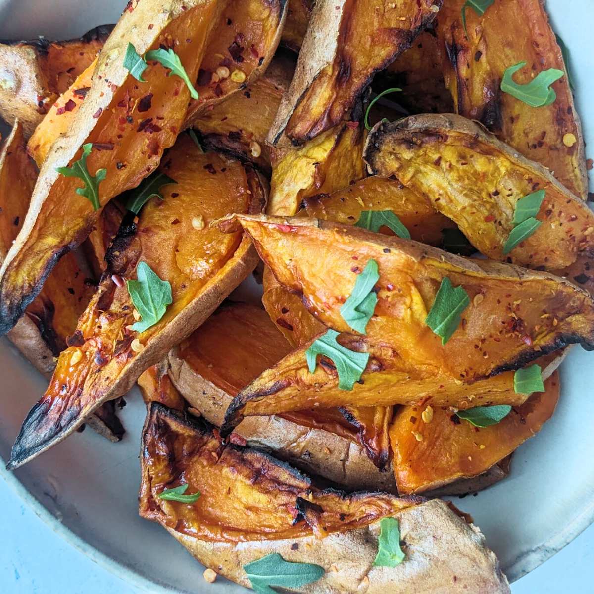 Sweet potato wedges in a white bowl
