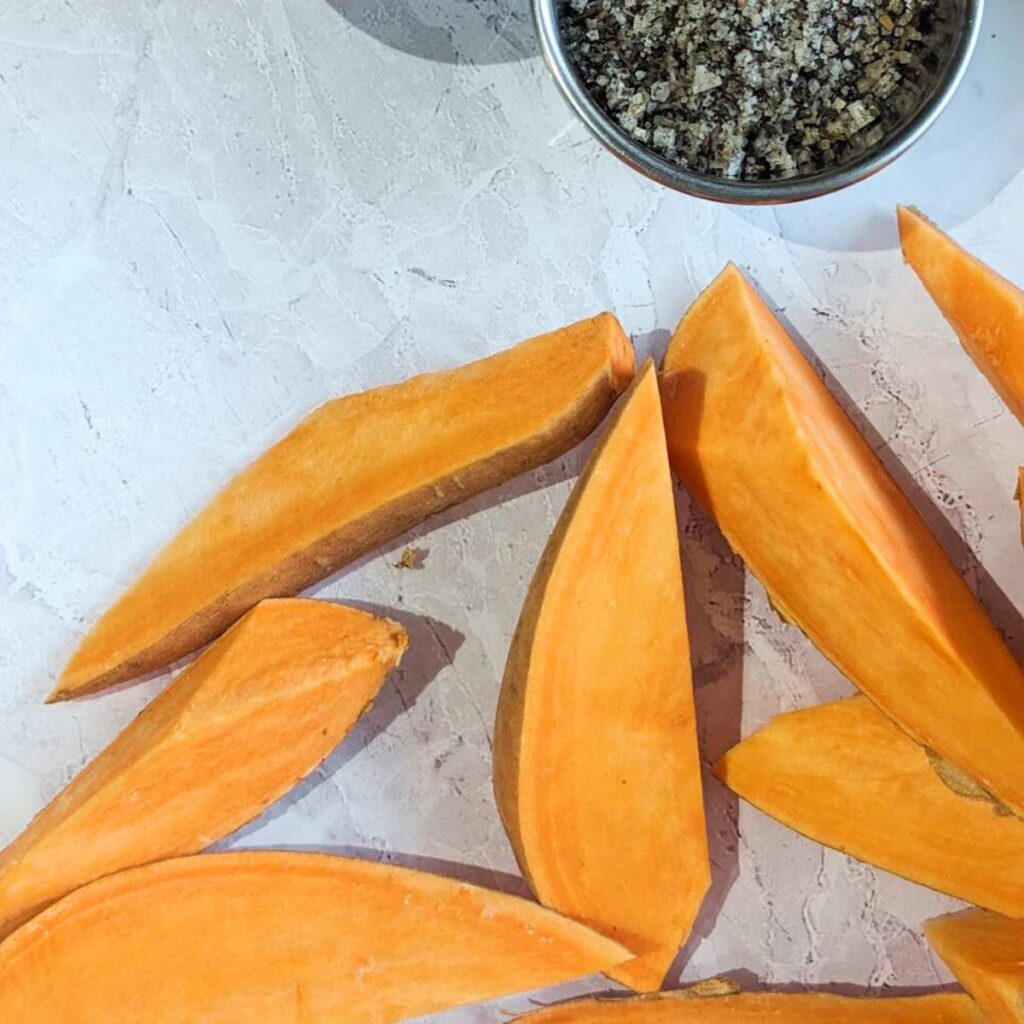 A sweet potato cut into wedges