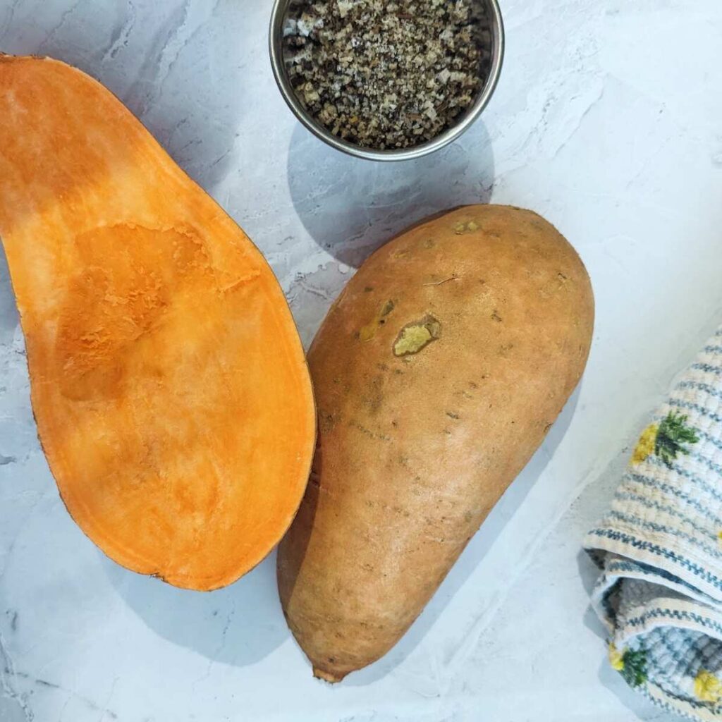 A sweet potato cut in half.