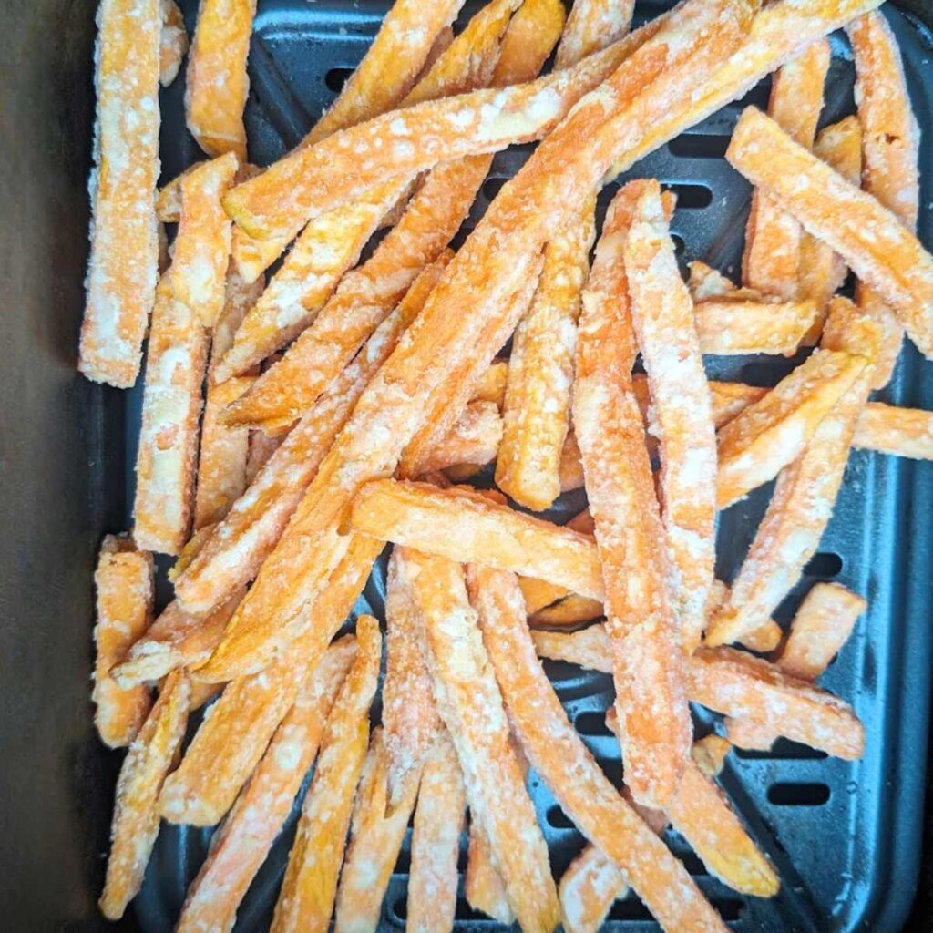 Frozen sweet potato fries in air fryer basket
