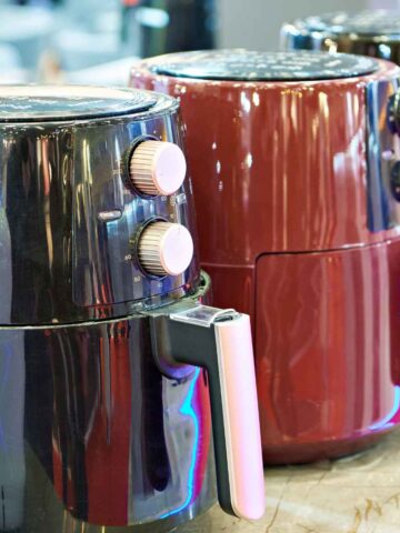 Two air fryers on display in a store.
