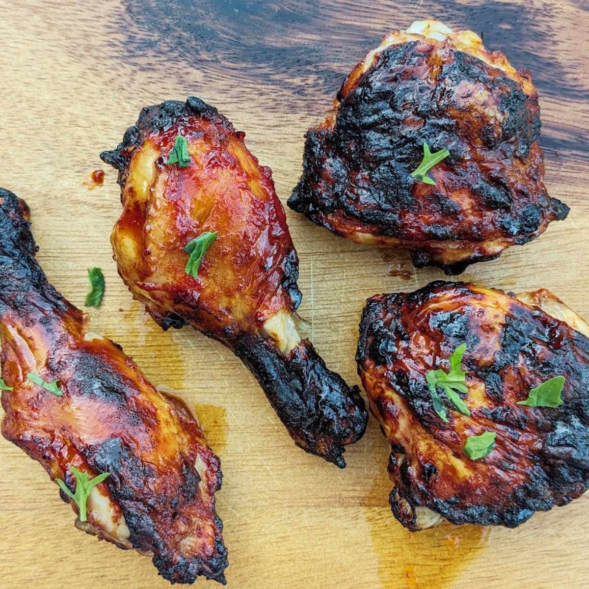 Barbecue chicken on a wooden board.