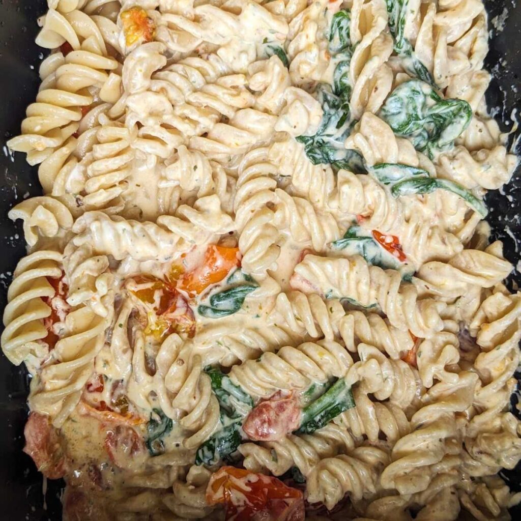 Pasta with Boursin sauce in an air fryer drawer.