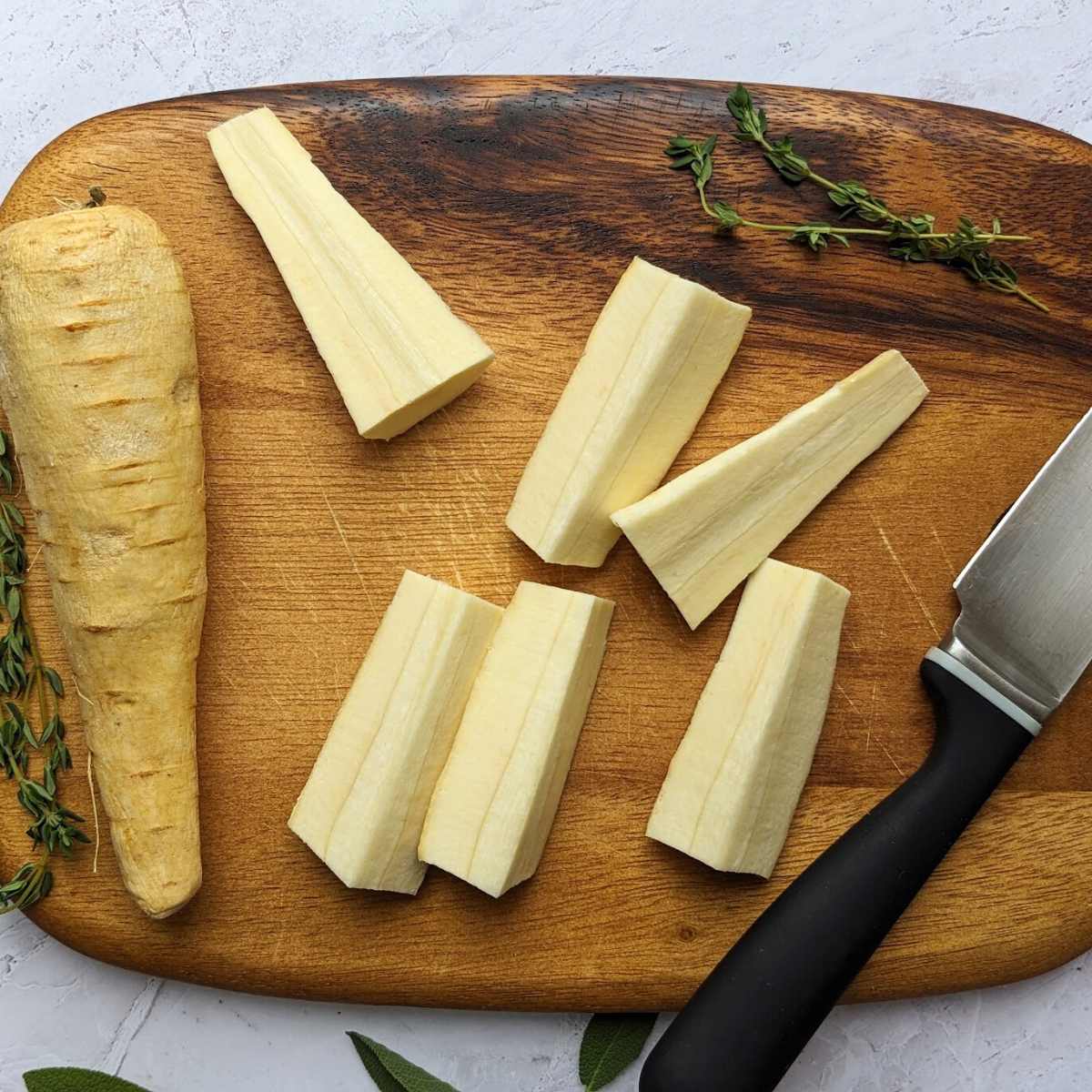 Parsnips on a chopping board..