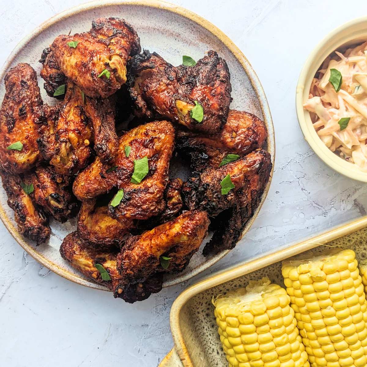 Air fryer buffalo wings with side dishes.