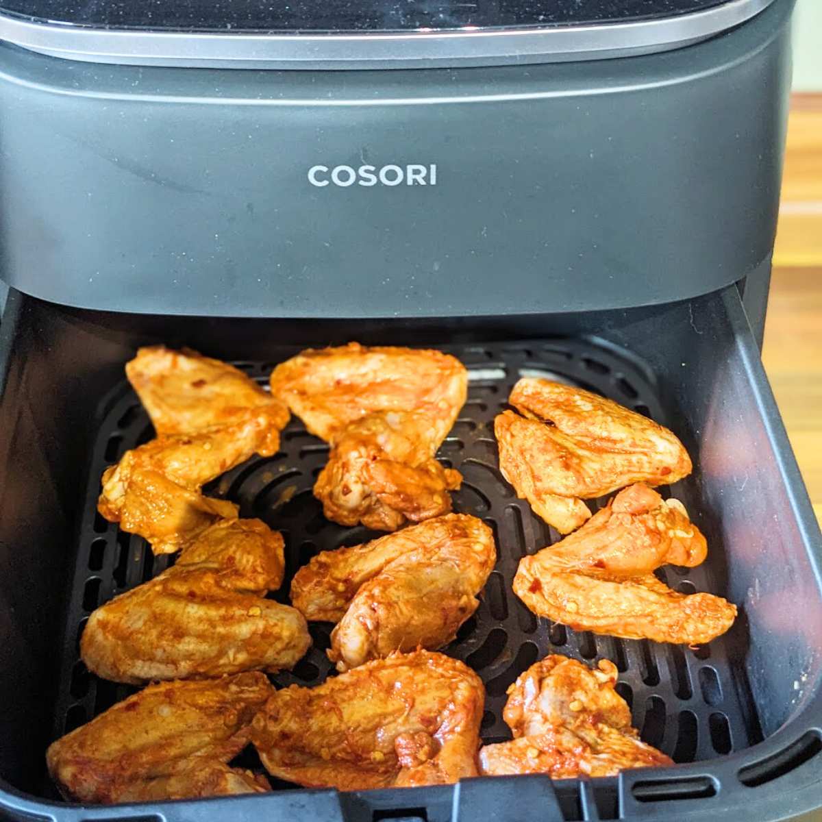 Chicken wings in air fryer basket