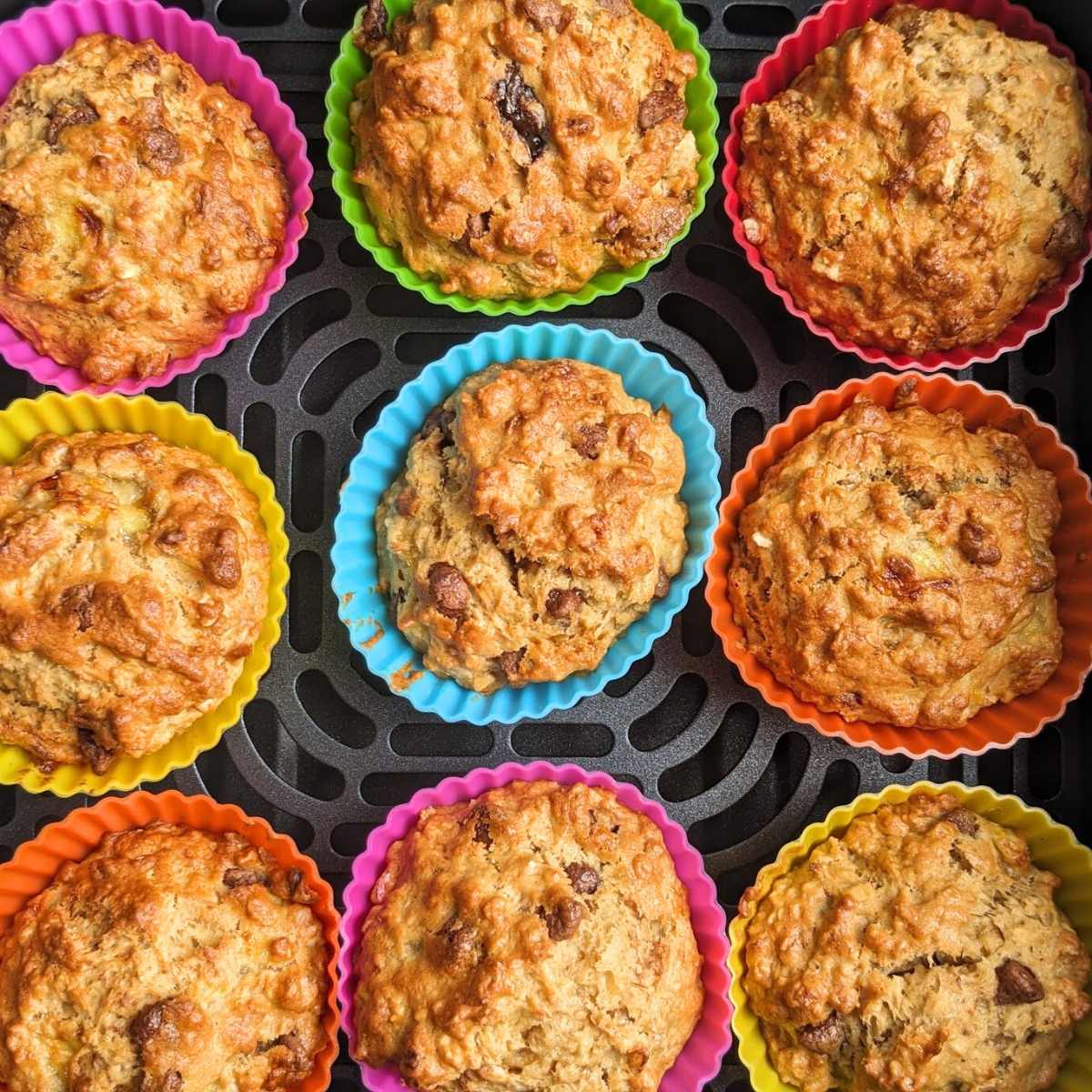 Banana muffins in an air fryer basket.